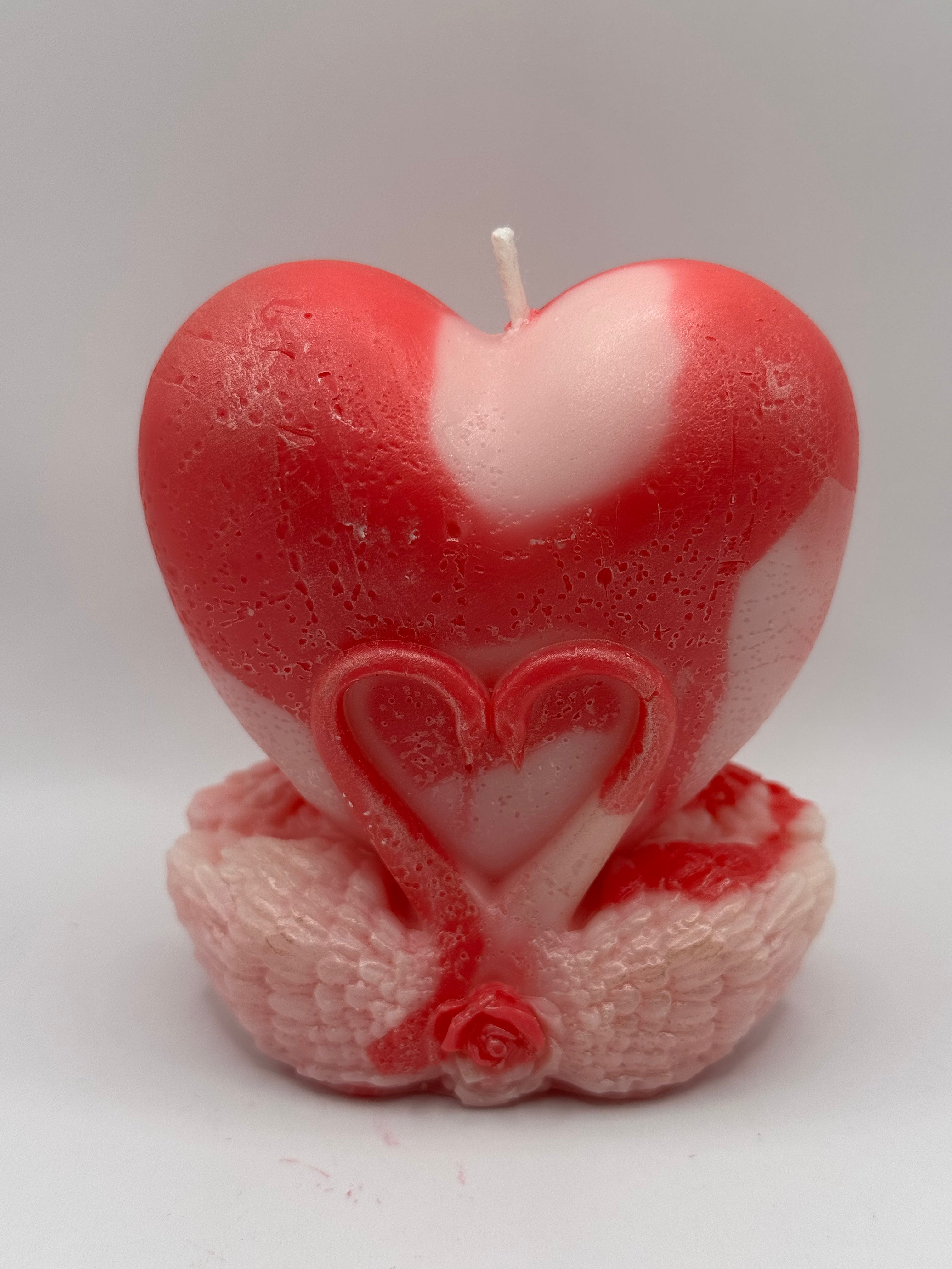 Eternal Love red and pink heart candle with swan wings and rose detail, a vibrant decorative piece for love-themed home accents or gifts.