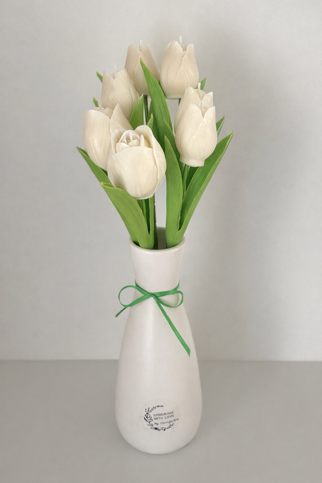 White tulips in ceramic vase for home decor