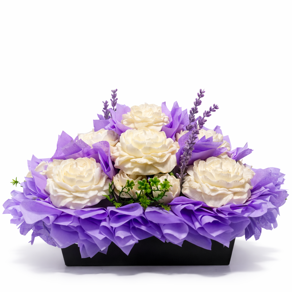 Purple floral candle decor with cream roses and lavender