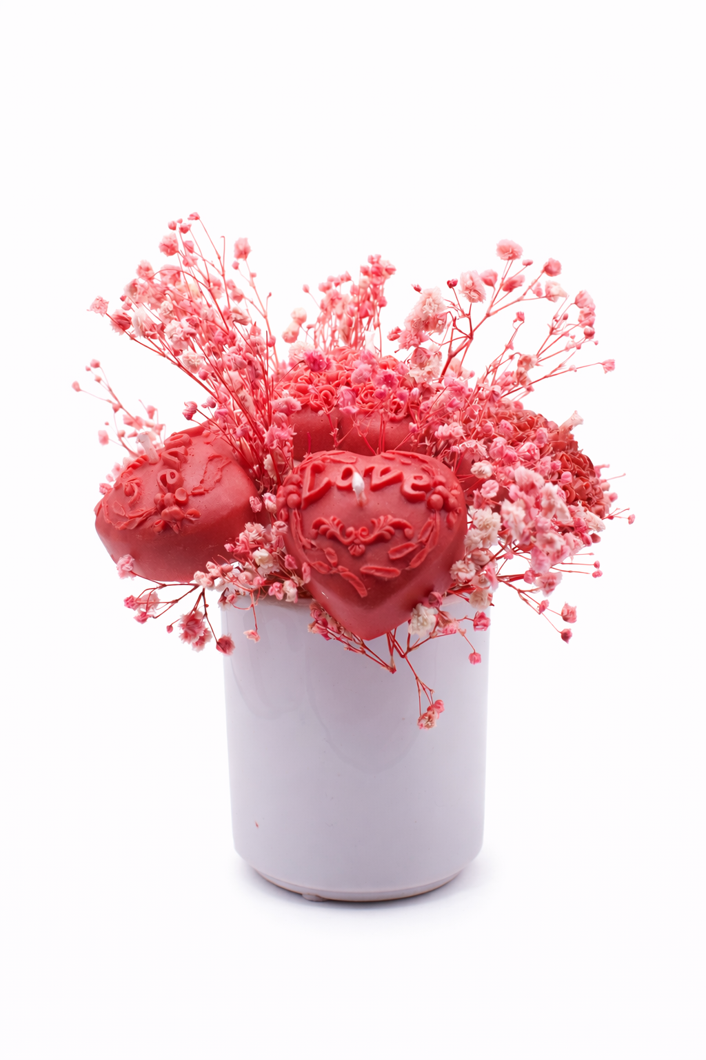 Pink and white flower candles in white vase